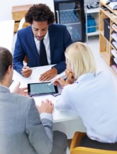 Client meeting with CPA in office, reviewing financial documents together_CPA consultation