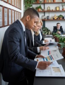 Professional CPA analyzing financial statements with aviation blueprints on table, modern office, business audit concept, clean layout, high detail